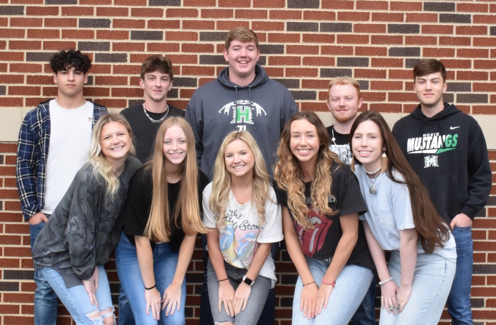 11 high school students smiling for camera 
